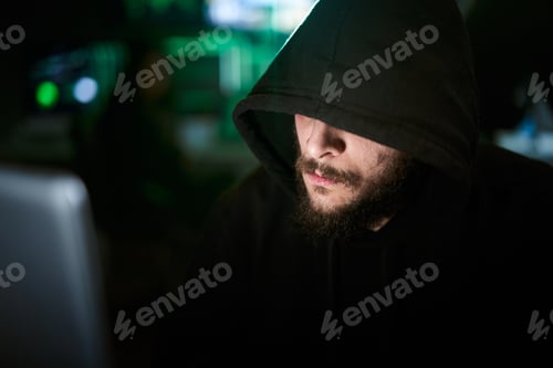 Preview: Criminal team Hacker using computer for organizing massive data breach attack
