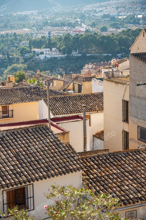 Preview: View of tile roofs of buildings in old town Polop, Spain
