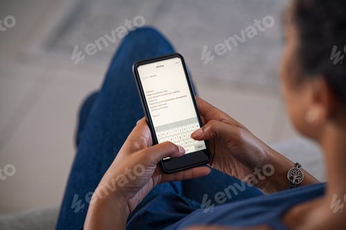 Preview: Woman typing email on smartphone