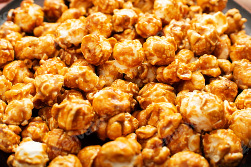 Preview: Caramelized sweet popcorn flakes gluten free food background