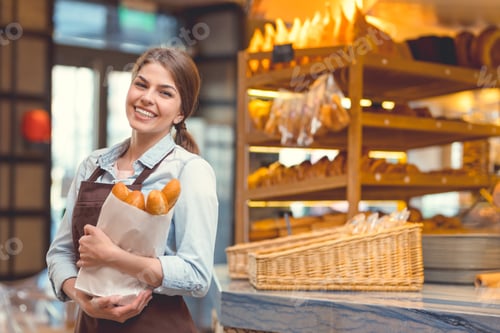 Preview: Young baker with baguettes