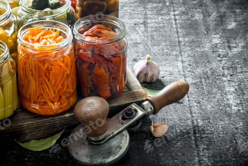 Preview: Jars of various preserved food on tray.