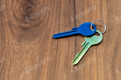 Preview: keys on wooden table background. rent sell buy apartment estate business