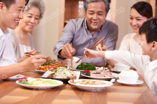 Preview: Happy Chinese family enjoying meal time