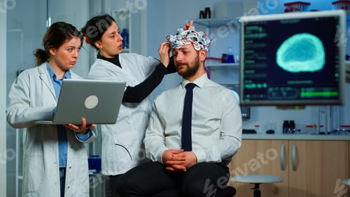 Preview: Team neurological researchers working together developing treatment