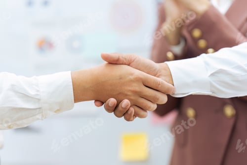 Preview: Closeup Handshake of employees after successful planning strategy marketing in the office