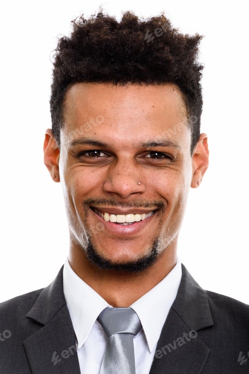 Preview: Face of young happy African businessman smiling