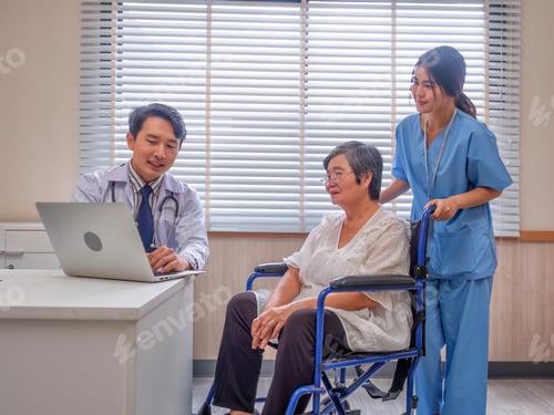 Preview: At hospital room patient sit on wheel chair looking laptop computer listen doctor explanation