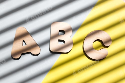 Preview: Wooden letters ABC on blue and yellow background