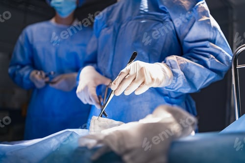 Preview: Surgeons Prepare Tools for Operation in Hospital Setting
