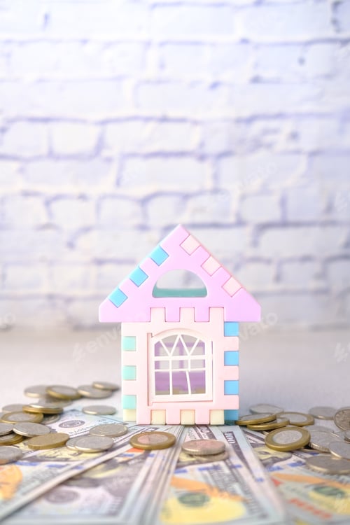 Preview: stack of coins and house on table , the concept of house finance