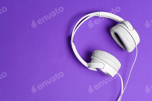 Preview: White headphones over a bright purple background