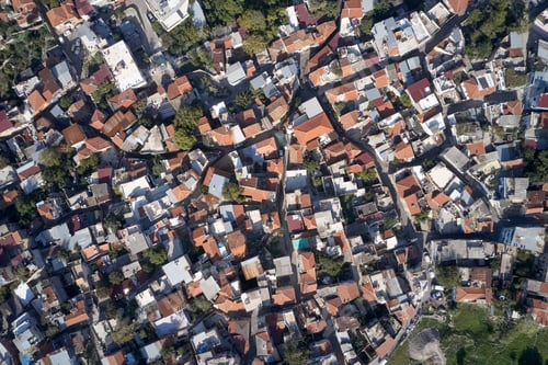 Preview: Top view of houses with red roofs.