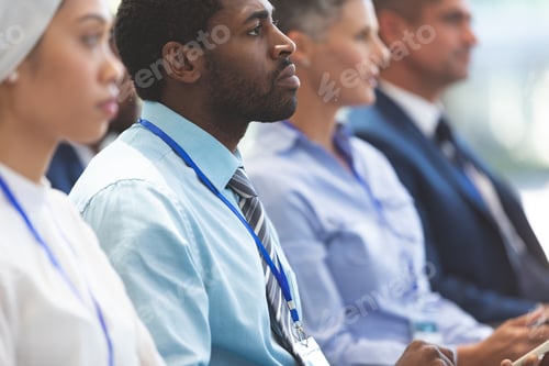 Preview: Side view of African american businessman attending a business seminar in office building