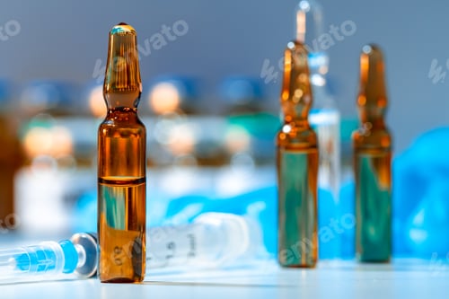 Preview: Vial of vaccine bottle with a syringe close up