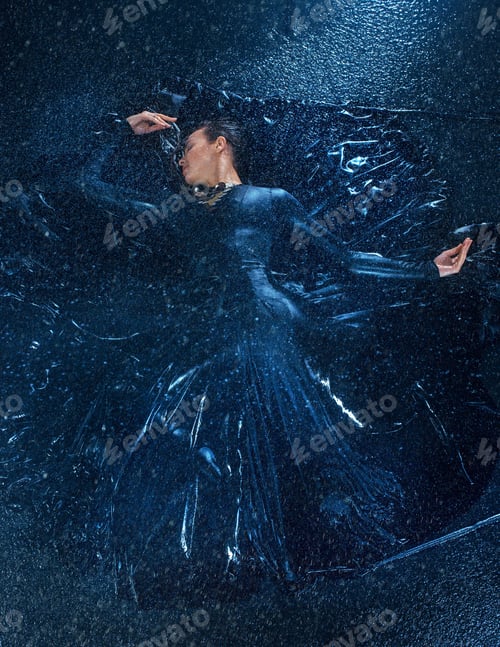 Preview: The young beautiful modern dancer dancing under water drops