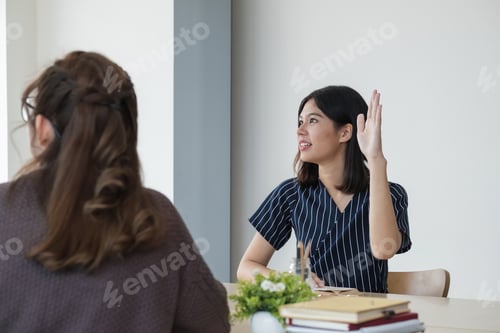 Preview: Cheerful English teacher discussion with Asian students