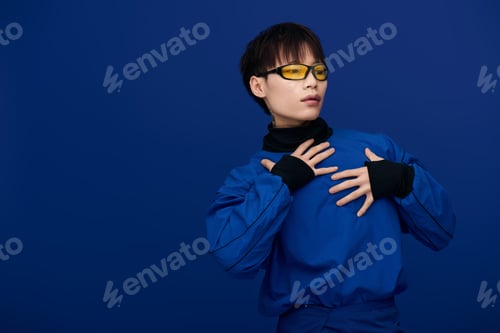 Preview: Young handsome Asian man in stylish blue outfit showcases fashion with creative poses