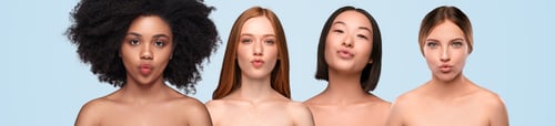 Preview: Young diverse female models with healthy skin giving kiss