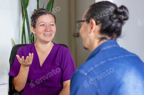 Preview: Female doctor explaining diagnosis to patient in medical office