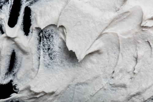 Preview: Structural Plaster White On A Black Background. White Cream. Paint Smear. Plasticine
