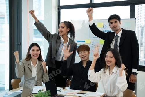 Preview: Business people discussing documents and ideas at meeting