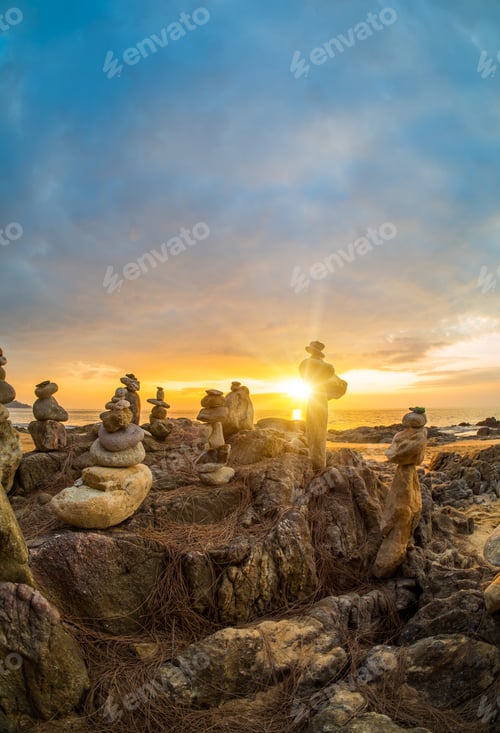 Preview: Stones pyramid on sand symbolizing zen, harmony, balance in Khao Lak Thailand