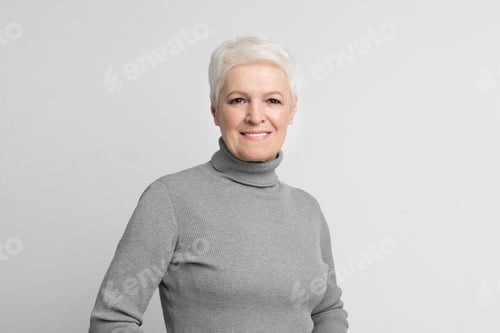 Preview: Senior woman looking at camera with a smile