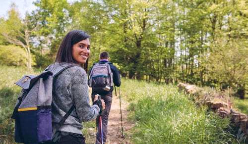 Preview: Woman doing trekking looking at camera