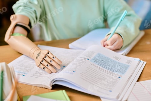 Preview: Writing and Studying with Prosthetic Arm at Desk