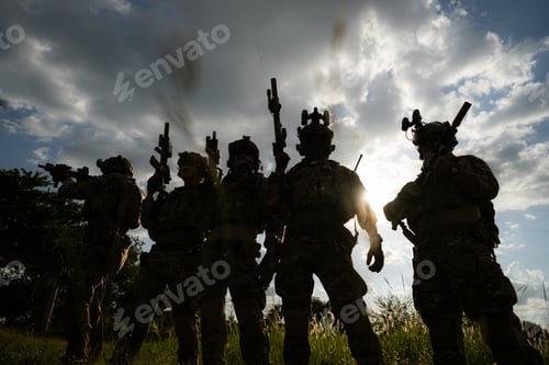 Preview: Soldier holding gun and showing action success or war win, special forces military training concept.