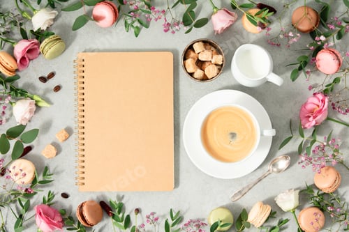 Preview: White cup of coffee, empty notebook and Frame made of Spring flowers