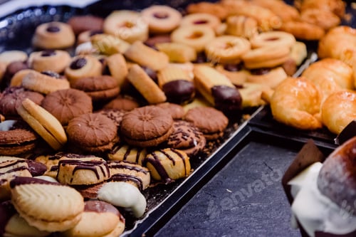 Preview: Selective focus shot of homemade assorted cookies on a baking pans