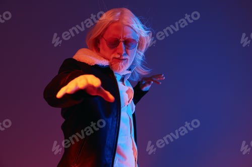 Preview: Stylish elderly man with long white hair and sunglasses posing dramatically against a colorful