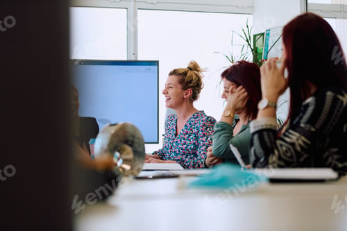 Preview: Diverse Business Team Discussing Projects in a Modern Glass Office.