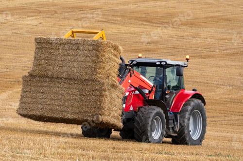 Preview: Agriculture - a tractor collecting bales of hay