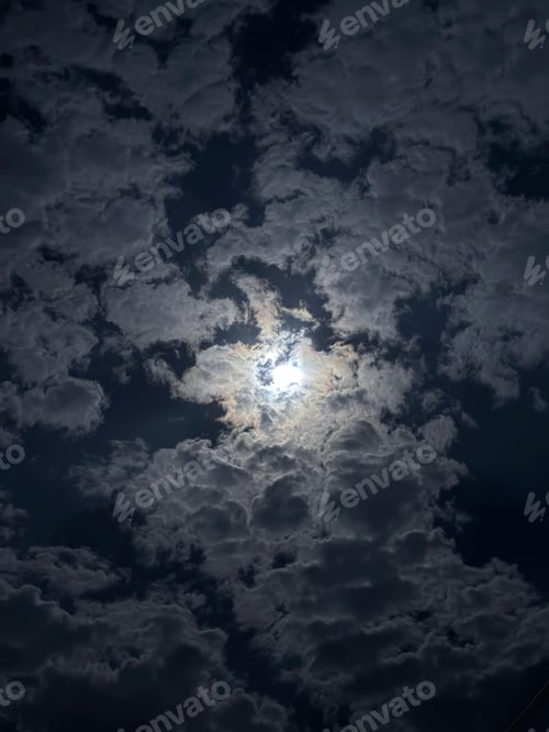 Preview: Dramatic night sky with hidden moon.