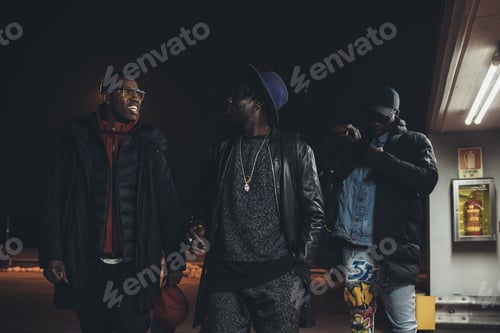 Preview: Three young african men walking in the street together