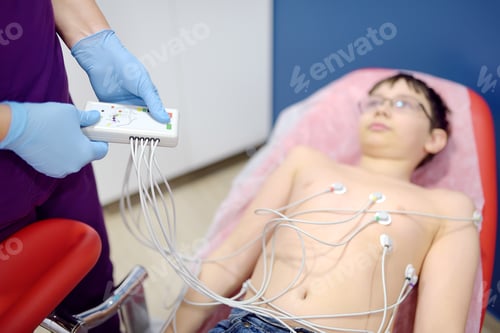 Preview: Child under ECG test with doctor