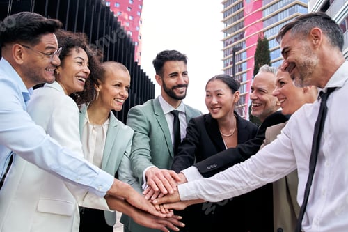 Preview: Diverse excited business team in suits joining hands in community. Fellowship, positive relationship
