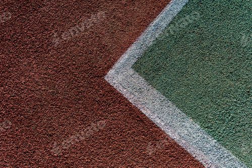 Preview: a overhead view of the white lines marking a tennis court, revealing the textured surface