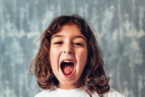 Preview: little girl screaming out loud on blue background
