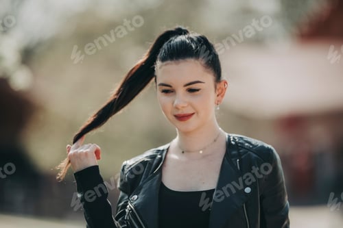Preview: Portrait of candid authentic zoomer girl by spring season mood among flowering trees outdoor