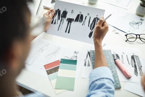 Preview: Man looking at sketches