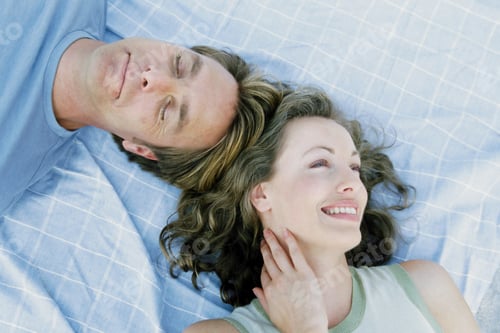 Preview: Man and woman lying down together