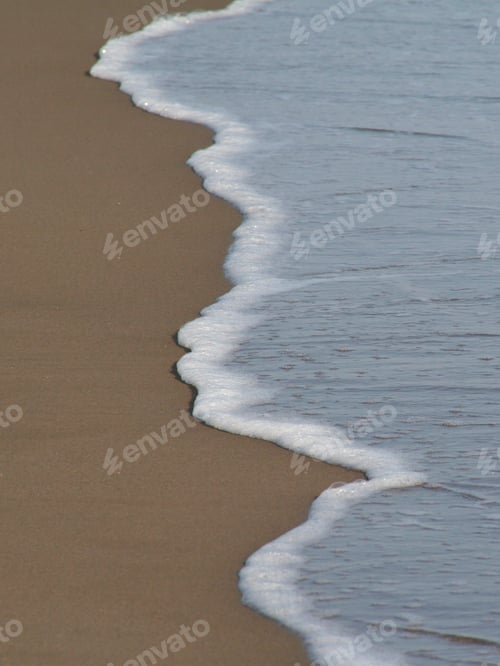 Preview: Beautiful smooth sand is caressed by the cool waters of the Pacific on a California beach