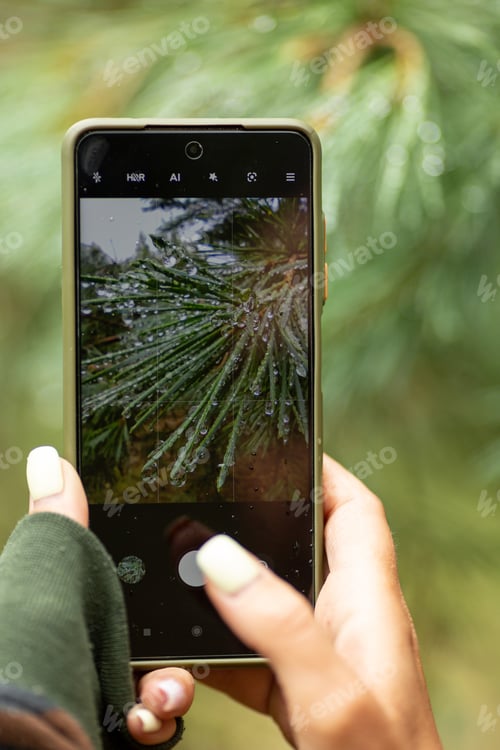 Preview: A woman takes a photo on a smartphone
