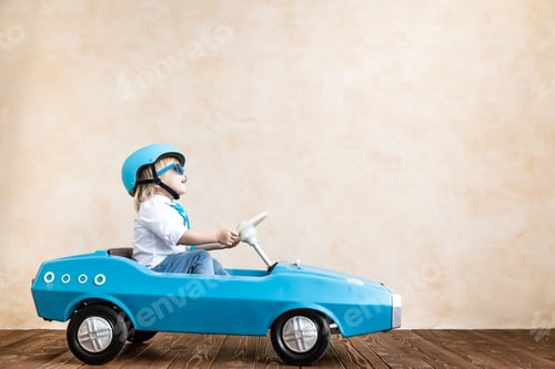 Preview: Funny kid driving toy car at home