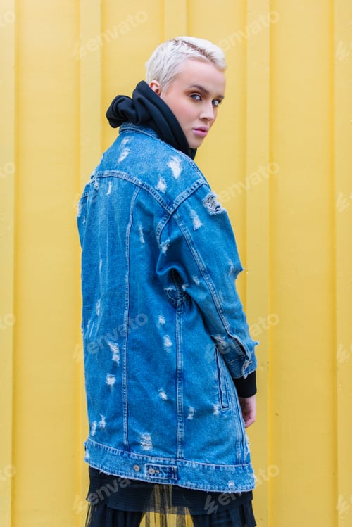 Preview: Young Woman in Distressed Denim Jacket