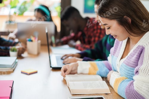 Preview: Students Studying Together at Desk with Laptops
